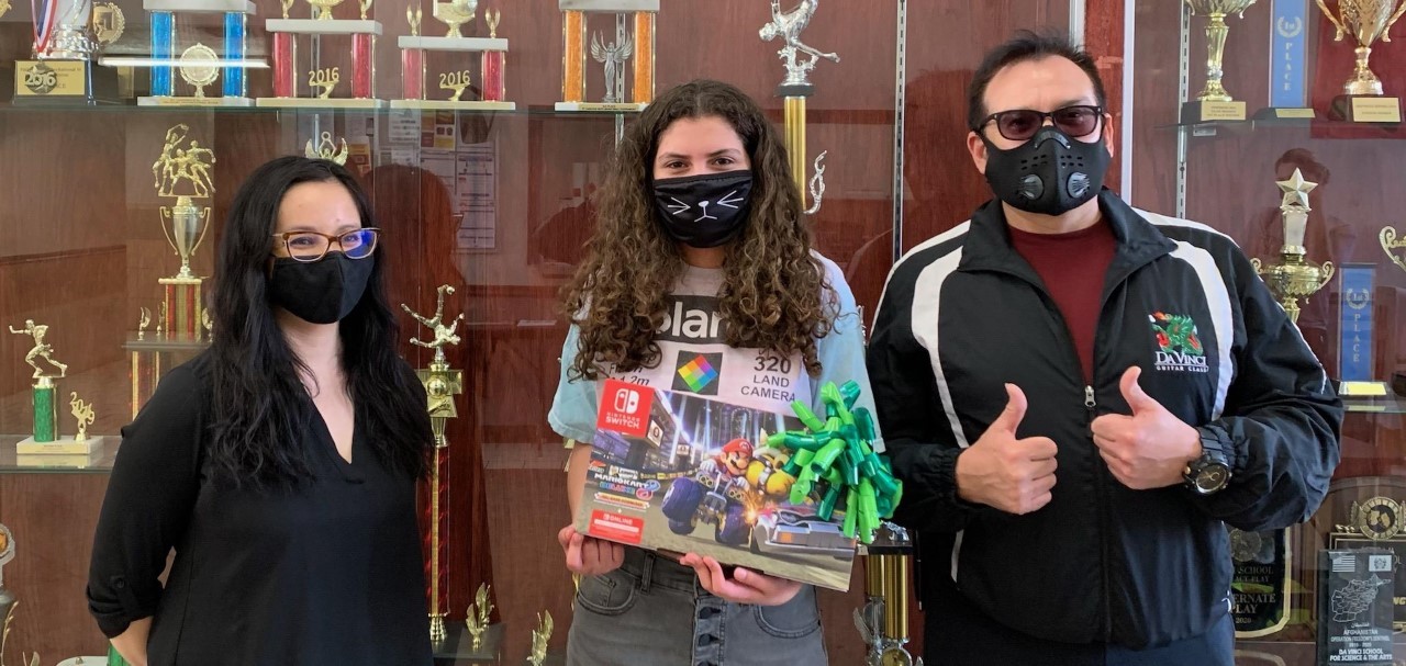 Left to right: Mrs. Montes-Anchondo, Paola Castro (holding the box for the Switch), and Mr. Garcia